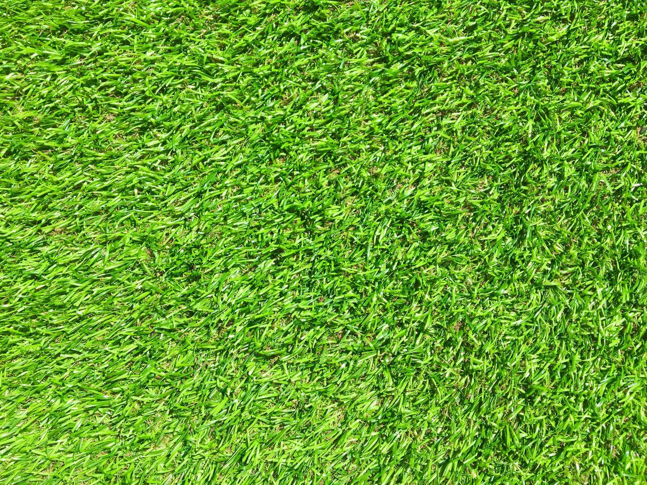 Artificial green lawn backyard for background. Texture for design photo