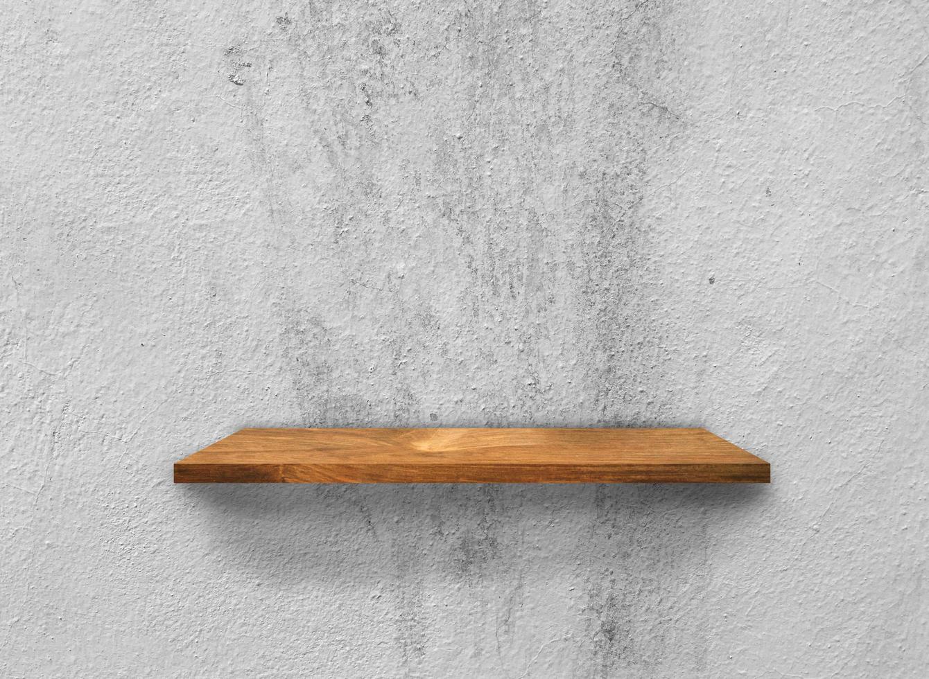 Rustic wooden shelf on grey concrete wall texture background with clipping path. pattern wallpaper photo