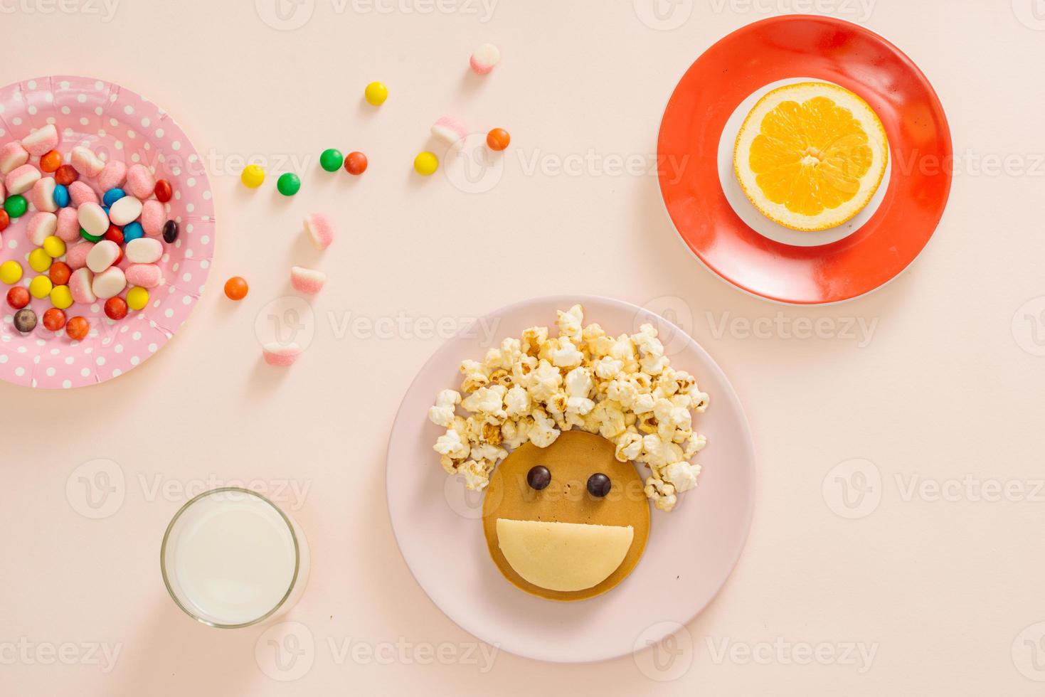 concept kid breakfast with pancake top view on white background photo