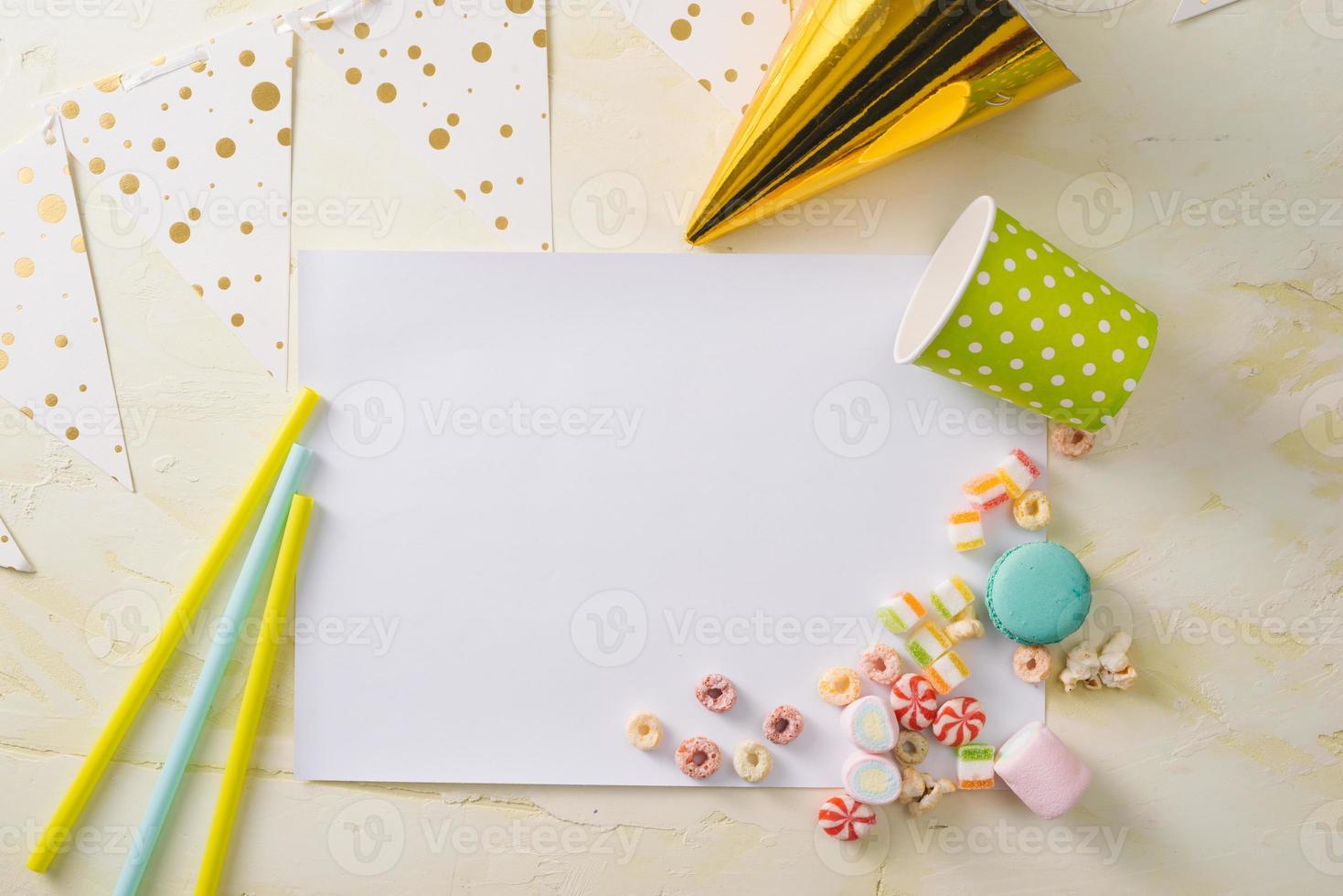 Party management and organization concept with sweets, confetti and blank pages. Creative celebration flat lay with copy space. photo