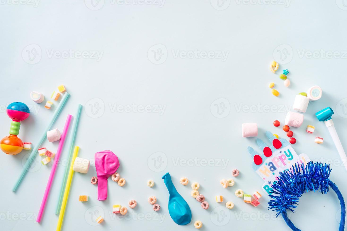 Colorful frame with party items on blue background. Happy birthday concept photo