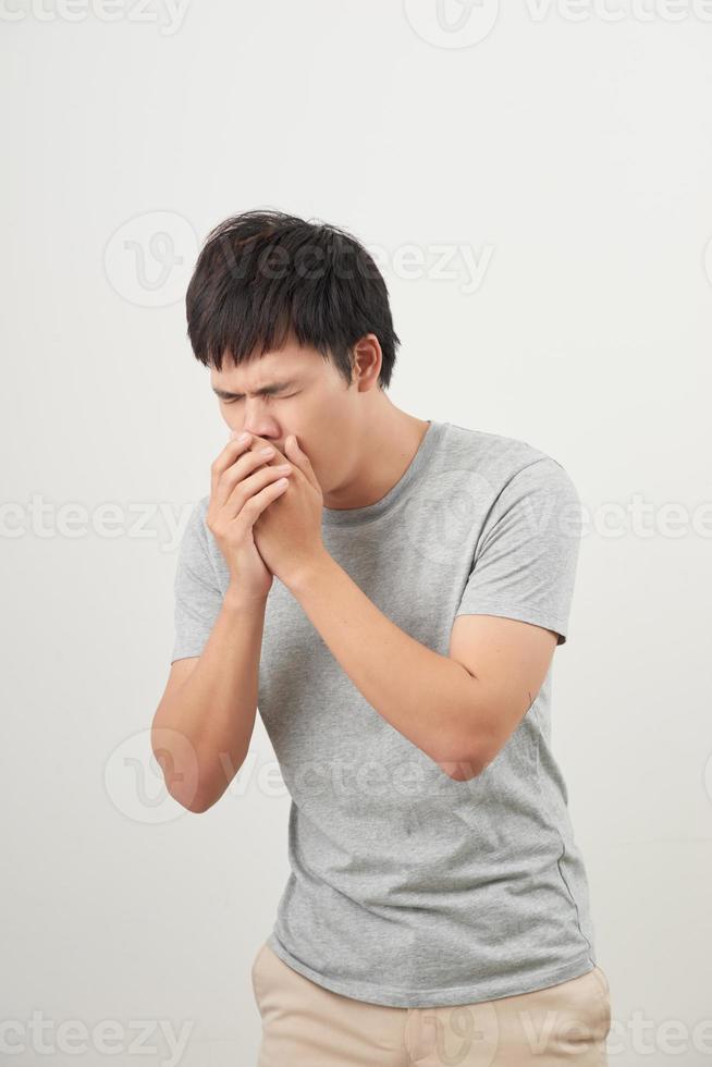 Mature man coughing on white background photo