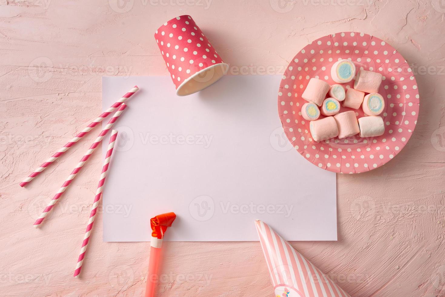 Party management and organization concept with sweets, confetti and blank pages. Creative celebration flat lay with copy space. photo