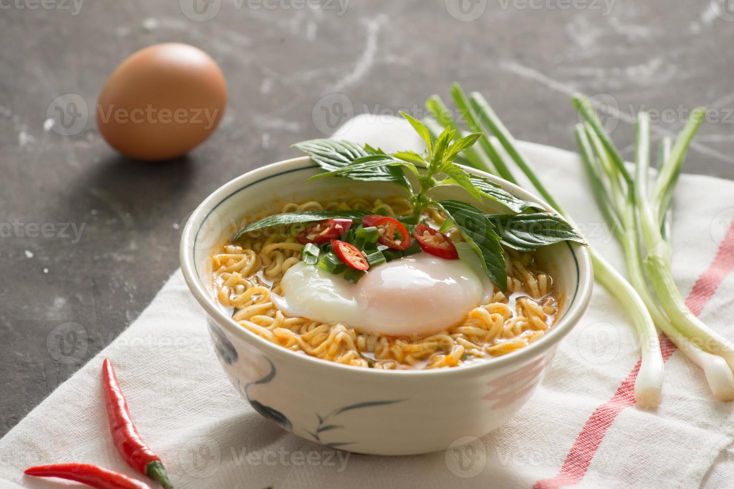 Instant noodles soup put egg and vegetables 12745351 Stock Photo at