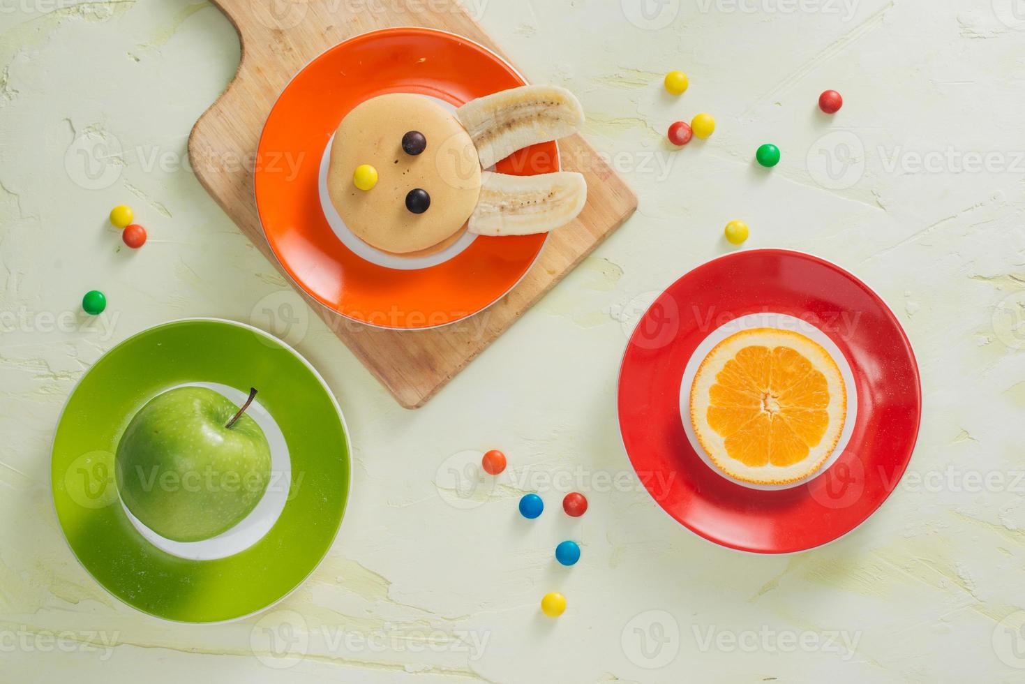 Funny bunny pancakes with fruits for Easter kids breakfast photo