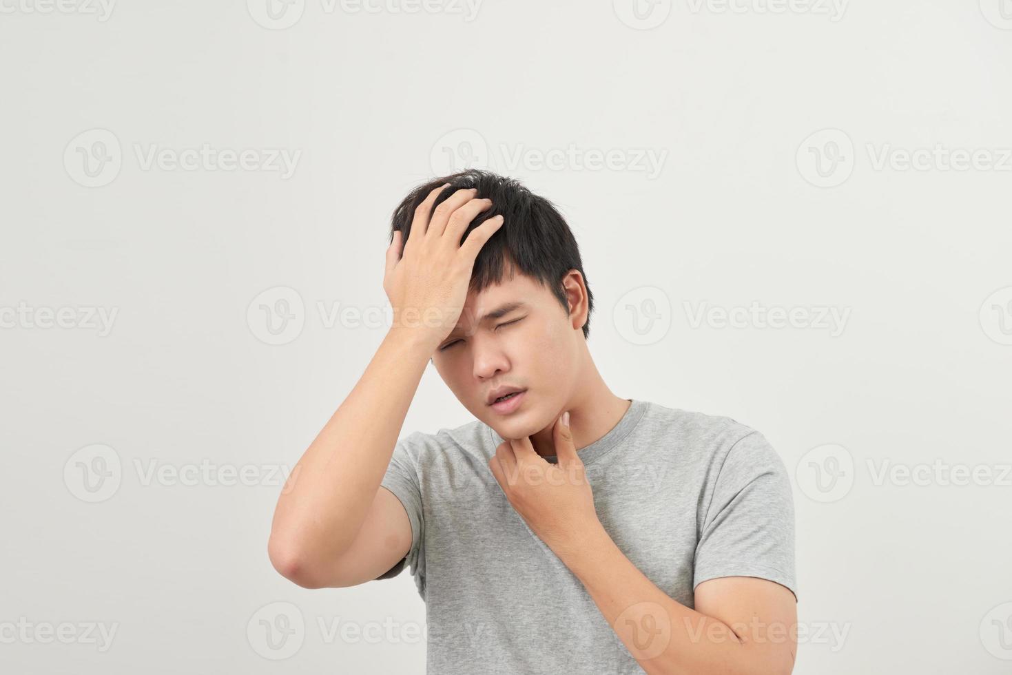 sick man has a sore throat isolated on a white background photo