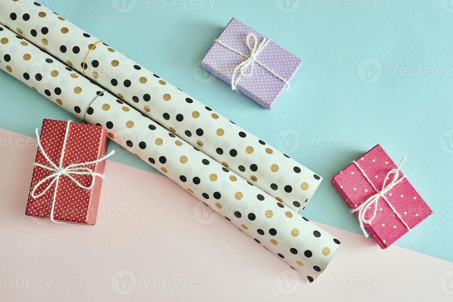 Different colored gift box on color background. photo