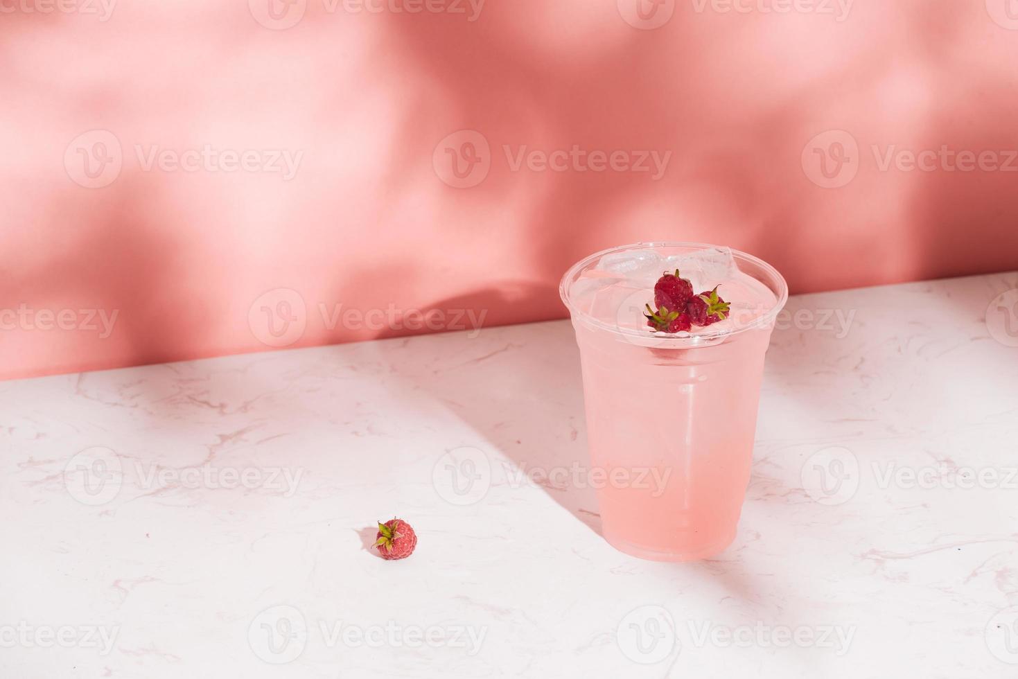 White wine with fresh raspberries. raspberry cocktail photo