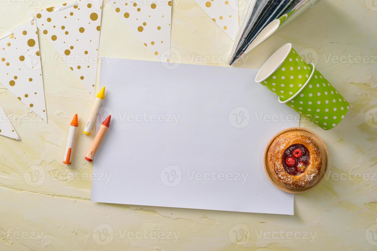 Party management and organization concept with sweets, confetti and blank pages. Creative celebration flat lay with copy space. photo