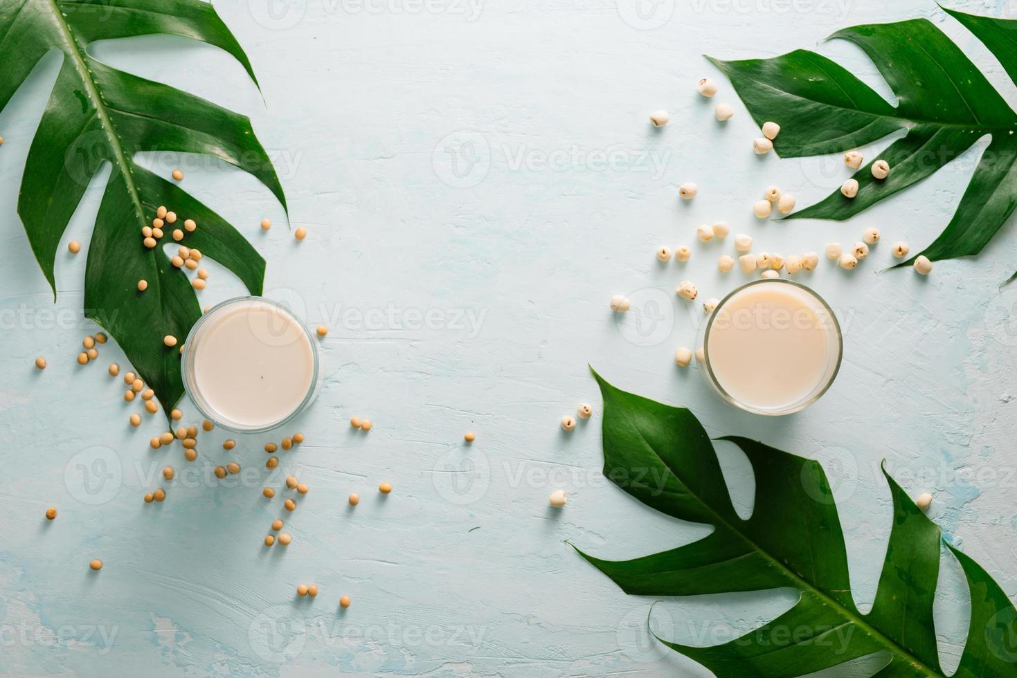 Soy milk or soya milk and soy beans on stone table. photo