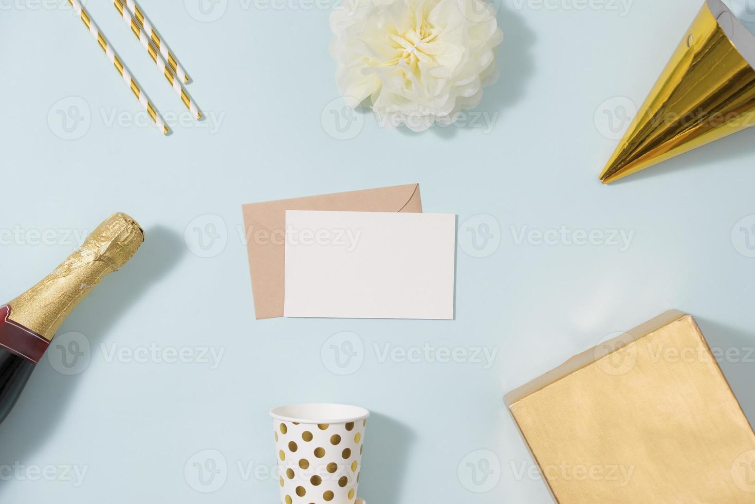 Flat lay Christmas or party background with gift boxs, champagne bottle, bows, decorations and wrapping paper in gold . Flat lay, top view photo
