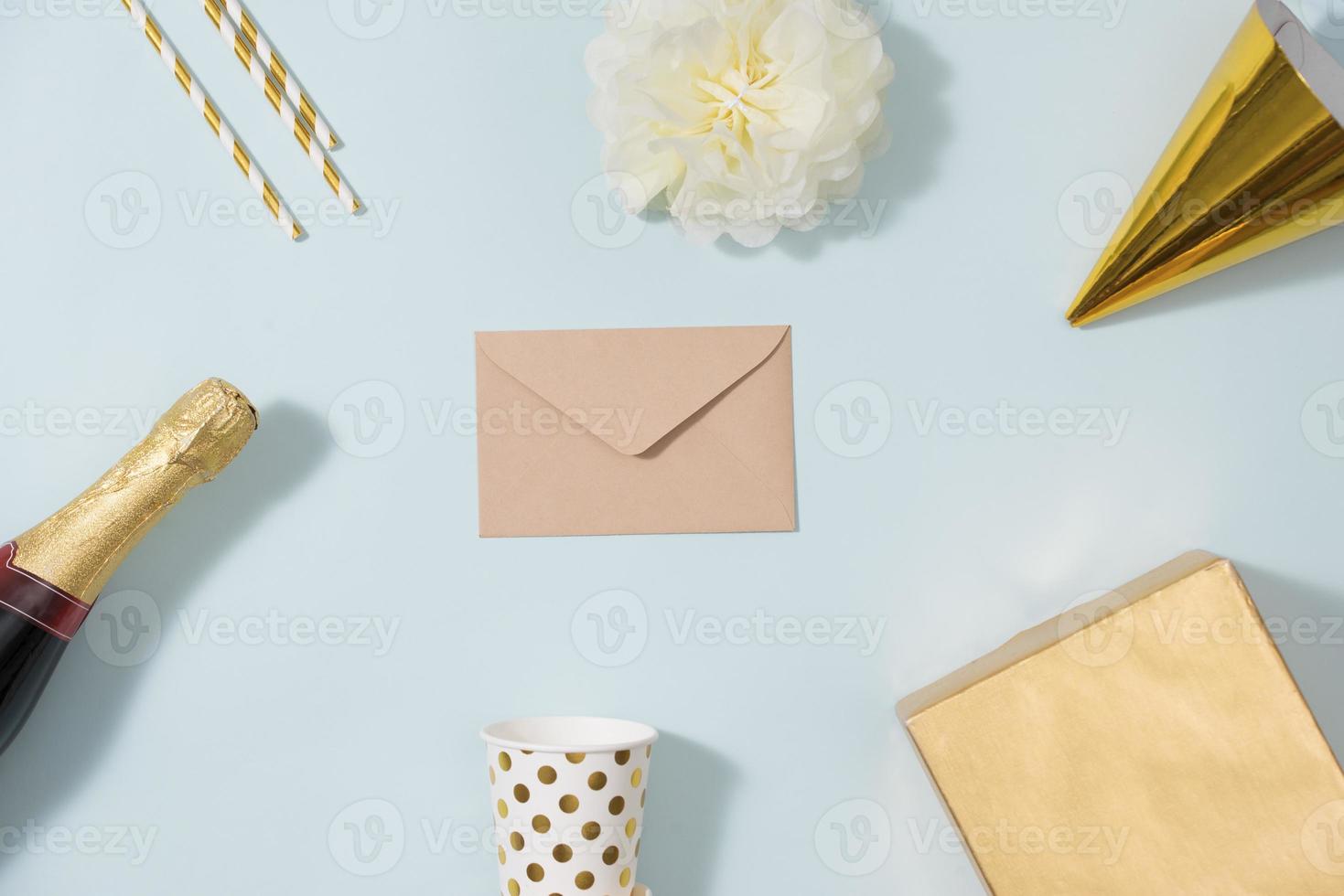 Flat lay Christmas or party background with gift boxs, champagne bottle, bows, decorations and wrapping paper in gold . Flat lay, top view photo