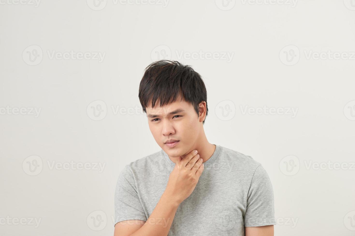 Allergies and sore throat concept. Sick young man on white background photo