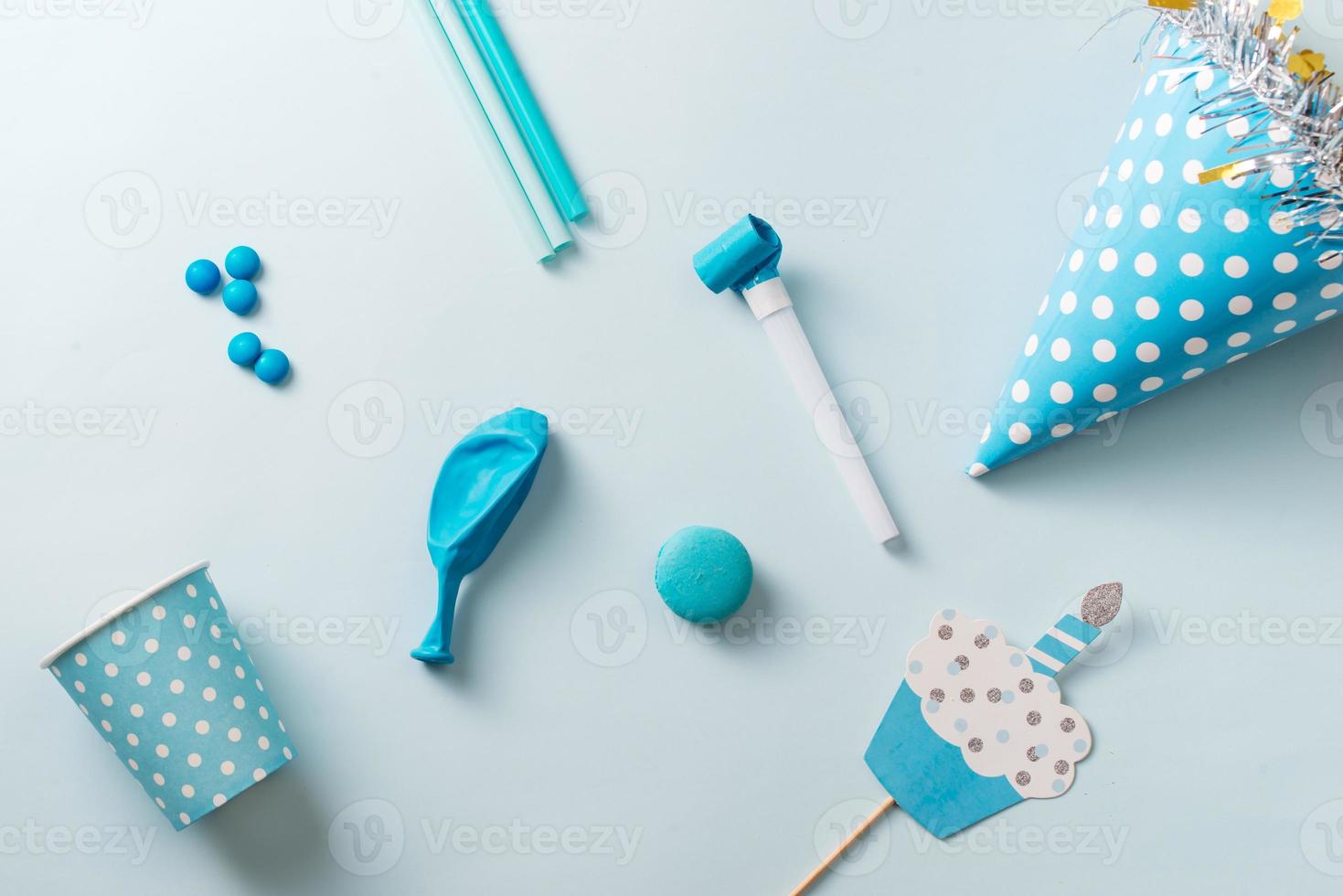 Boy birthday decorations. Blue table setting from above with muffins,  drinks and party gadgets. Background layout with free text space. 12747155  Stock Photo at Vecteezy