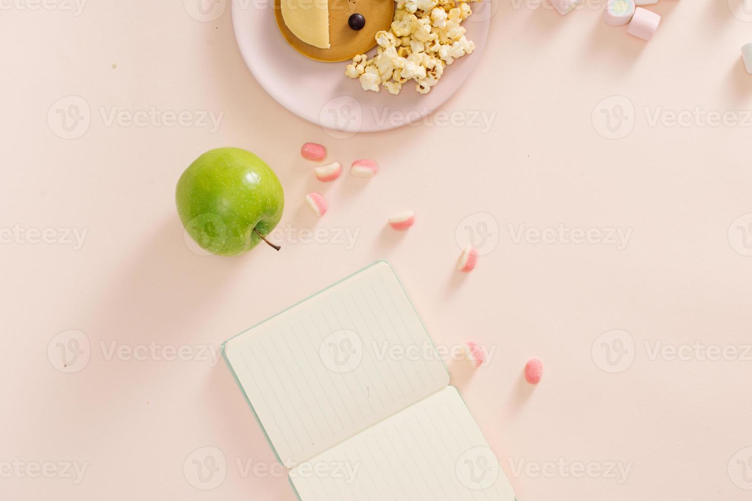 Baby pancakes for breakfast. Creative idea for the kid dessert delicious pancakes in the form of the happy face with the hair making popcorn photo