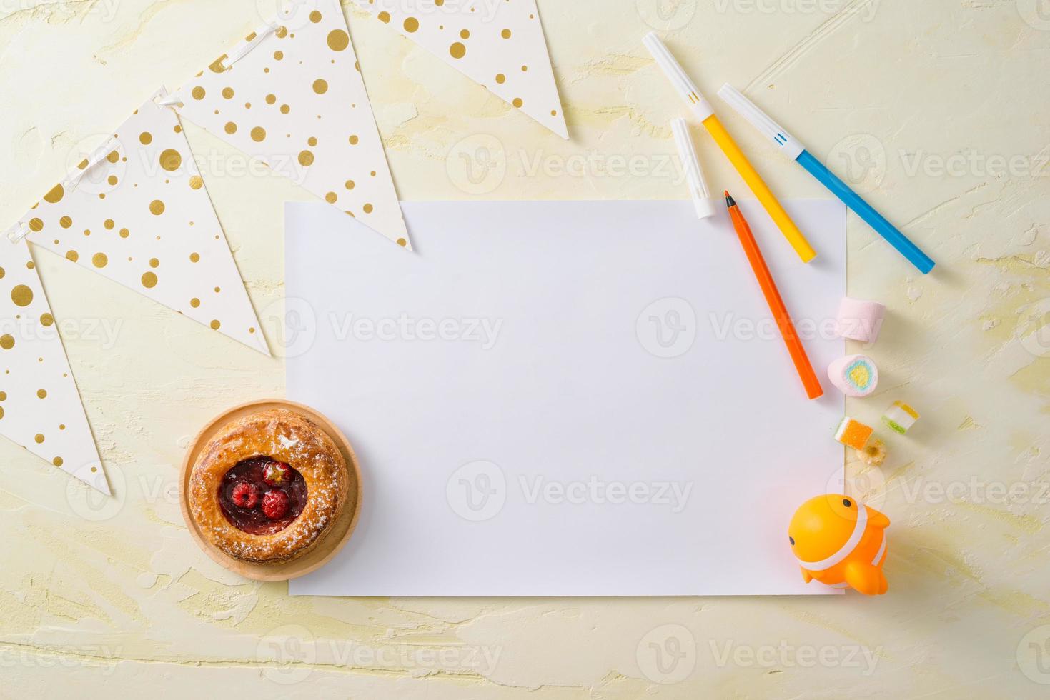 Party management and organization concept with sweets, confetti and blank pages. Creative celebration flat lay with copy space. photo