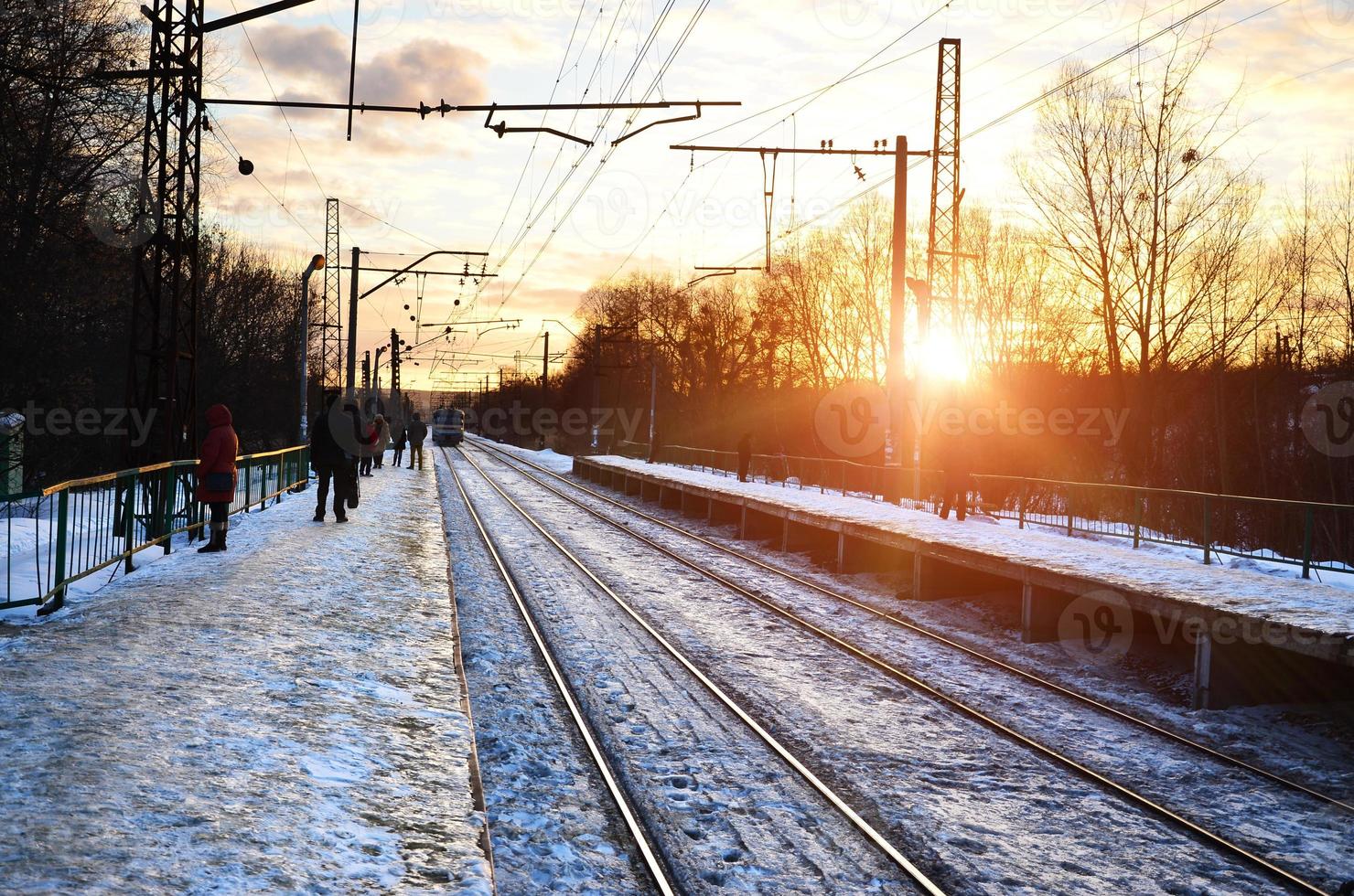 Evening winter landscape with the railway station photo