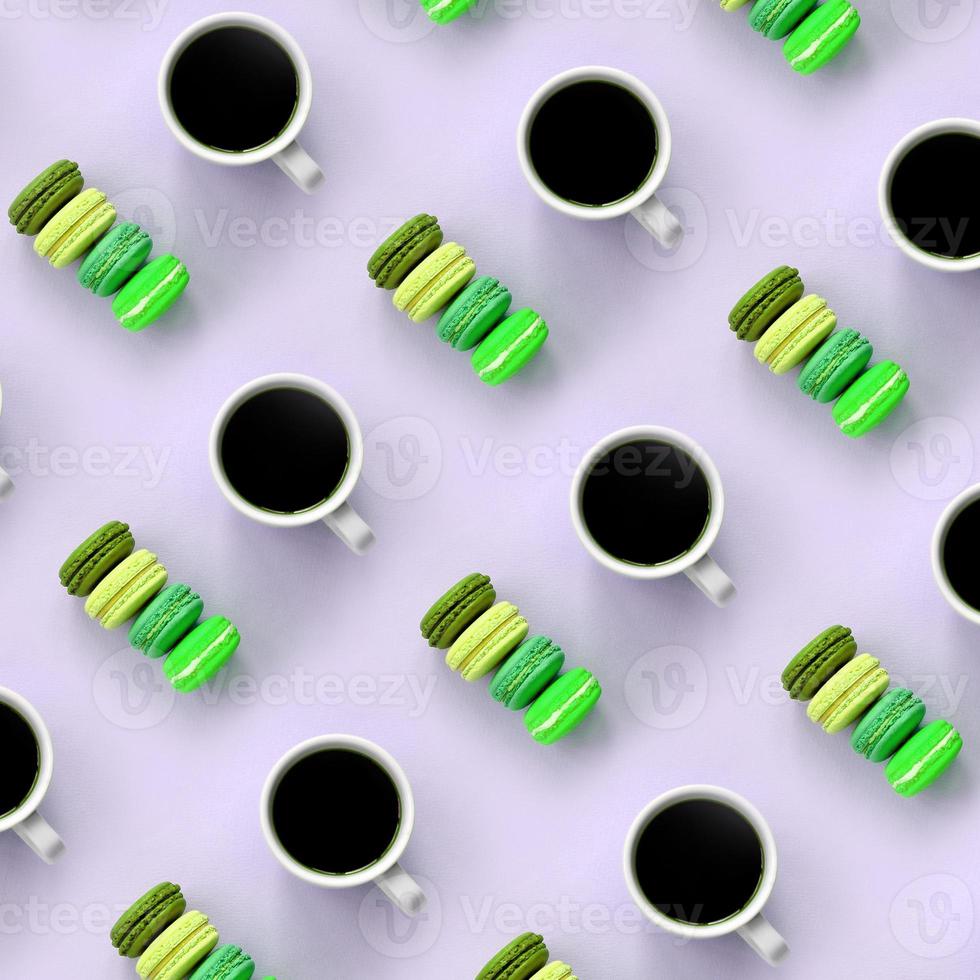 A pattern of many colorful dessert cake macaroon and coffee cups on trendy pastel lilac background top view photo