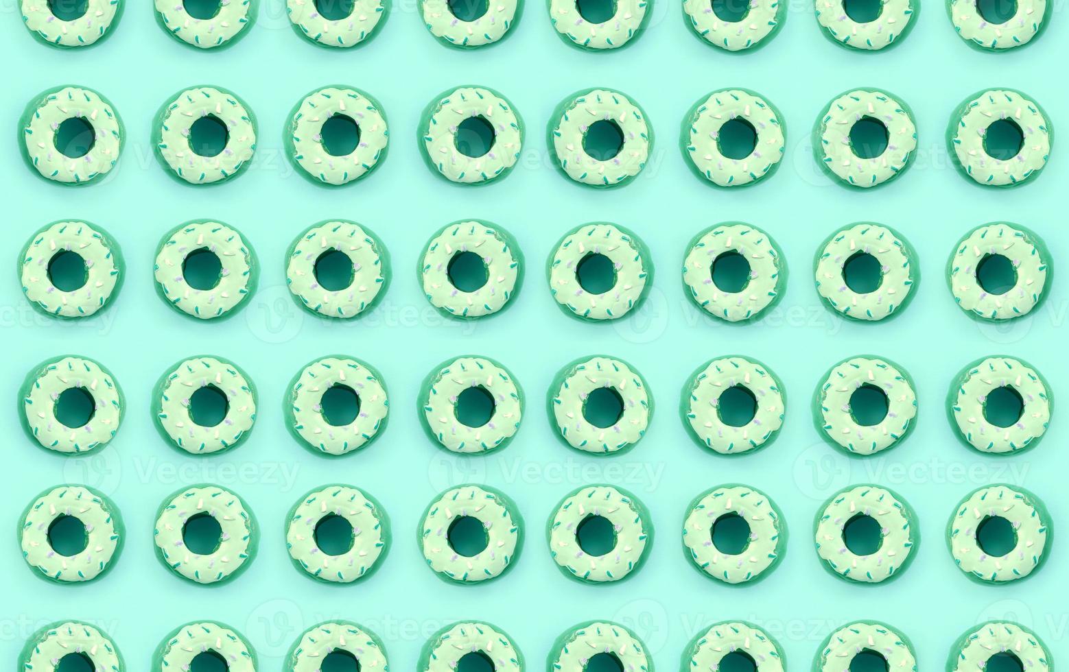 Many small plastic donuts lies on a pastel colorful background. Flat lay minimal pattern. Top view photo