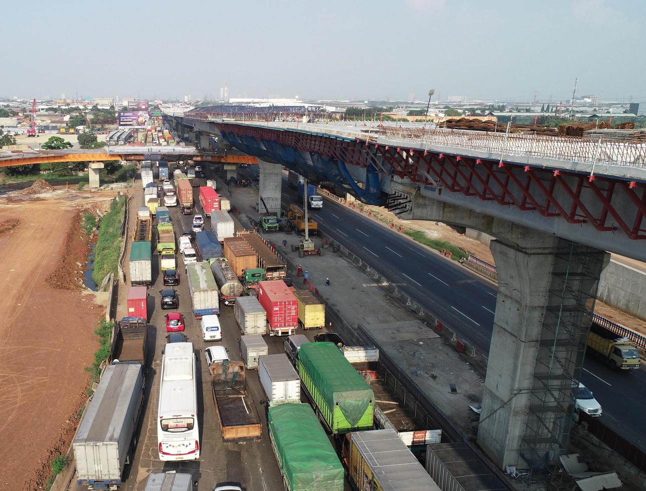 Jakarta, Indonesia in August 2019. Top view photo of cars and trucks that are in a toll road jam