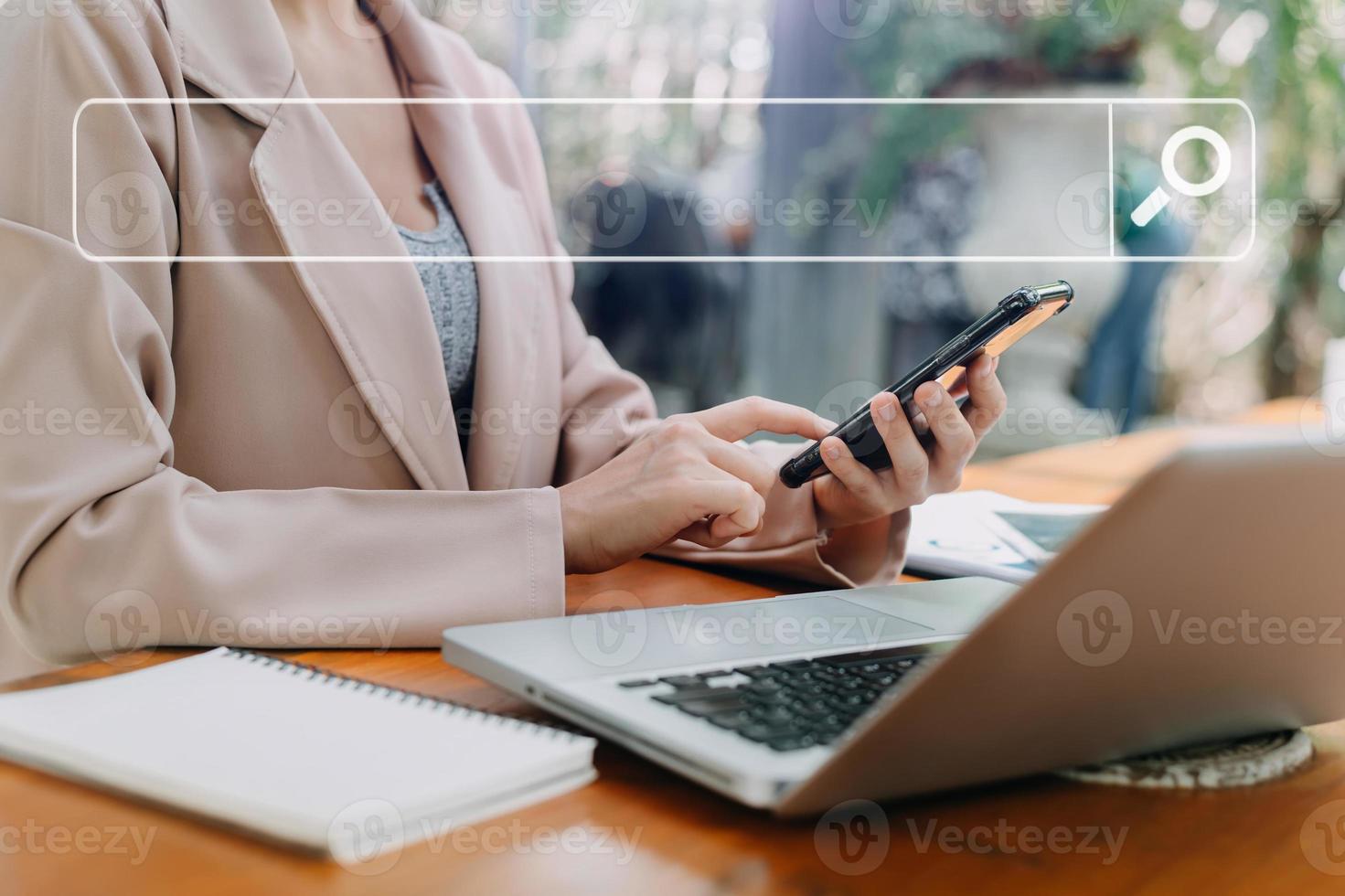 Searching Browsing Internet Data Information Networking Concept with blank search bar.businessman working with mobile phone and laptop computer VR icon in office photo
