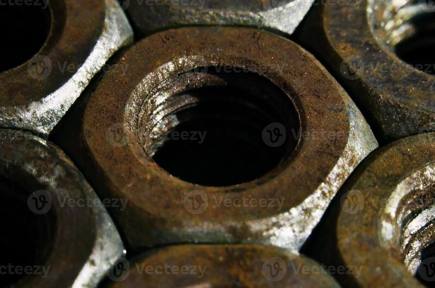 Close-up of rusty nuts photo