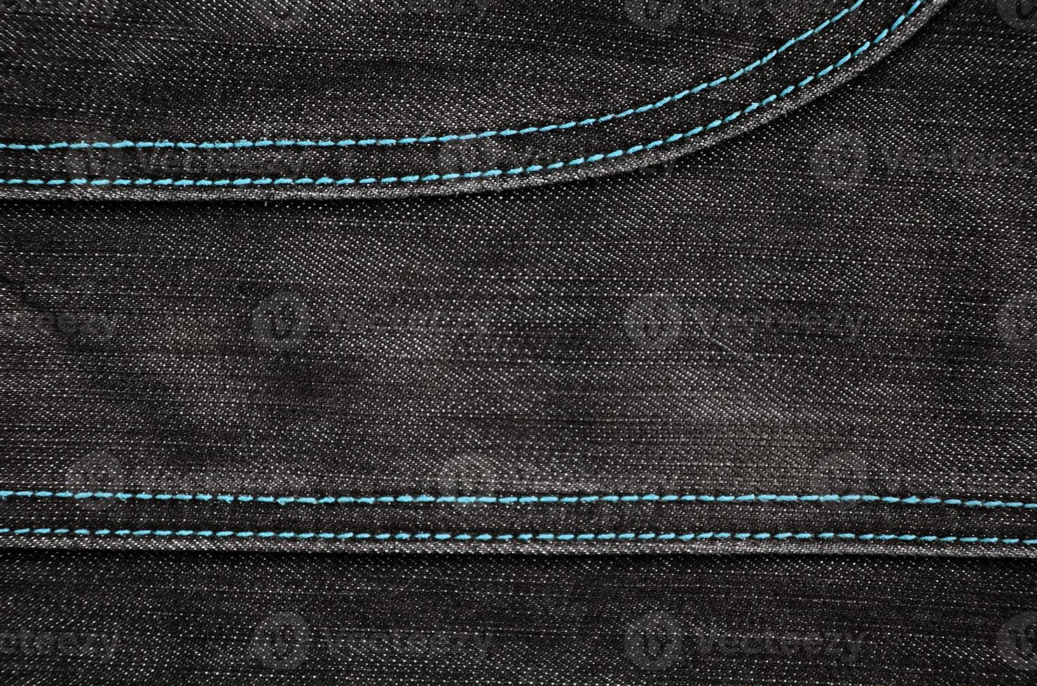 The texture of black denim cloth photo