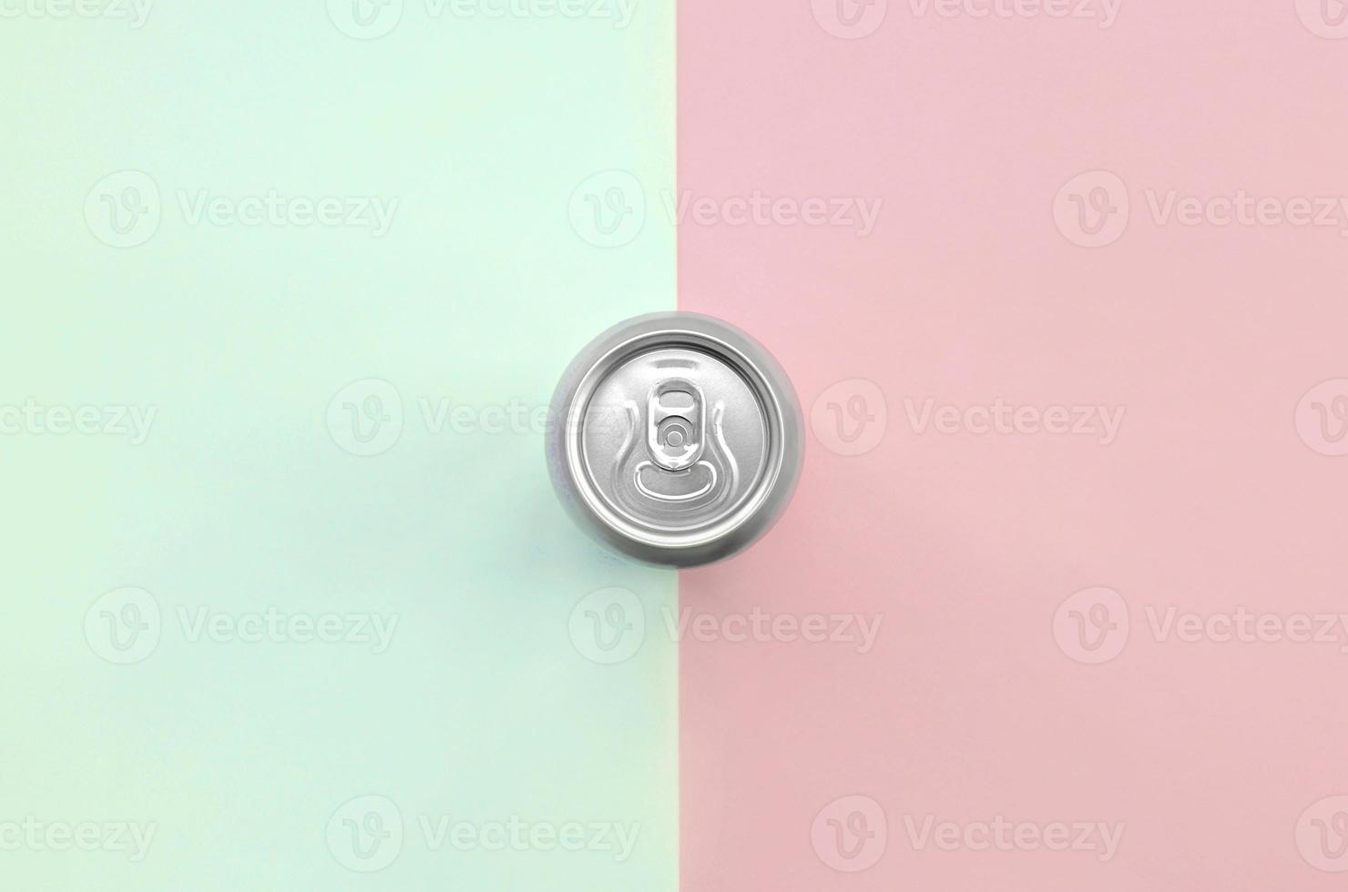 Metallic beer can on texture background of fashion pastel turquoise and pink colors photo