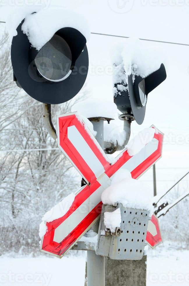 Semaphore is located on the motorway crossing the railway line in winter season photo