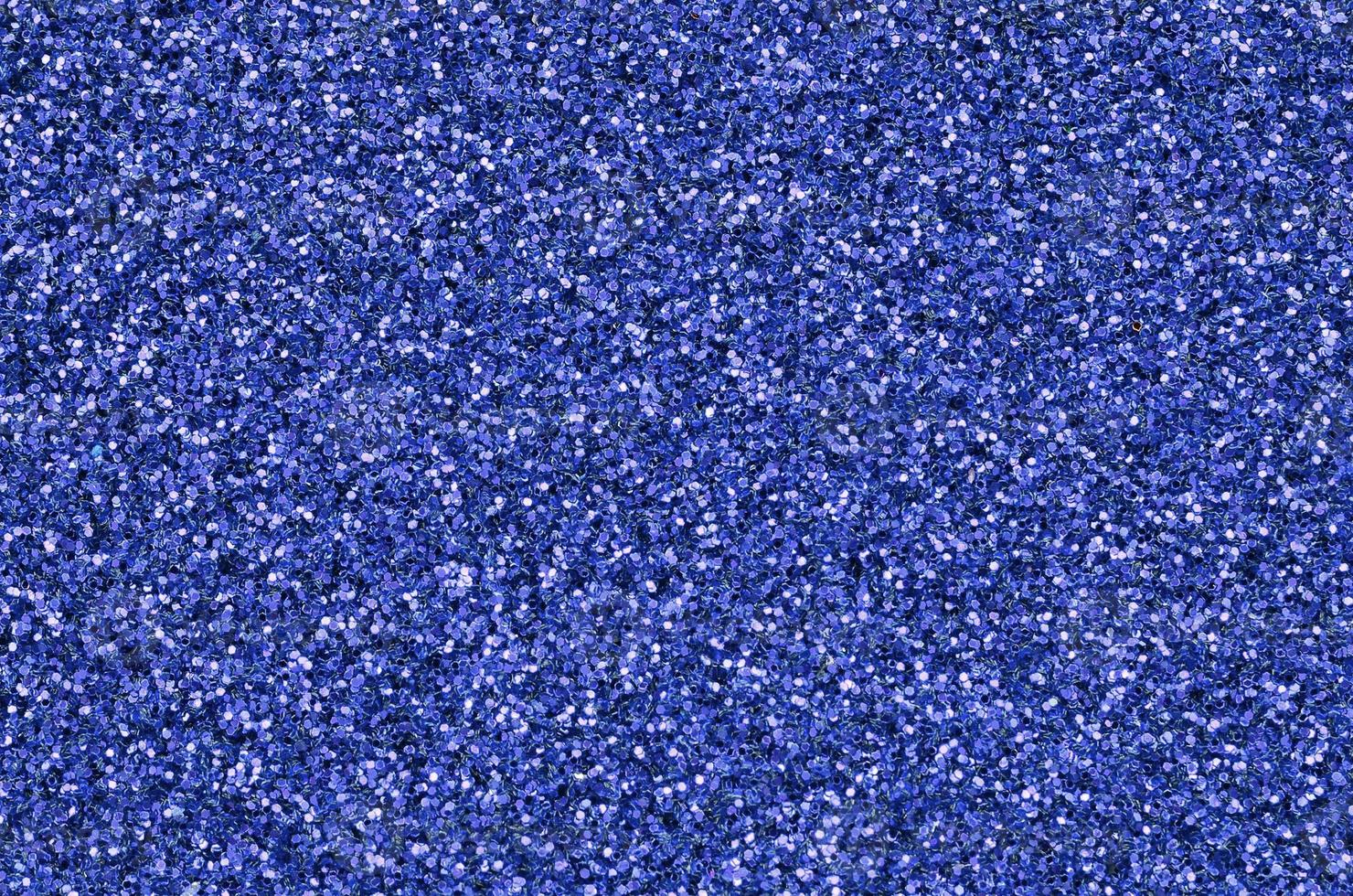 Blue decorative sequins. Background image with shiny bokeh lights from small elements photo