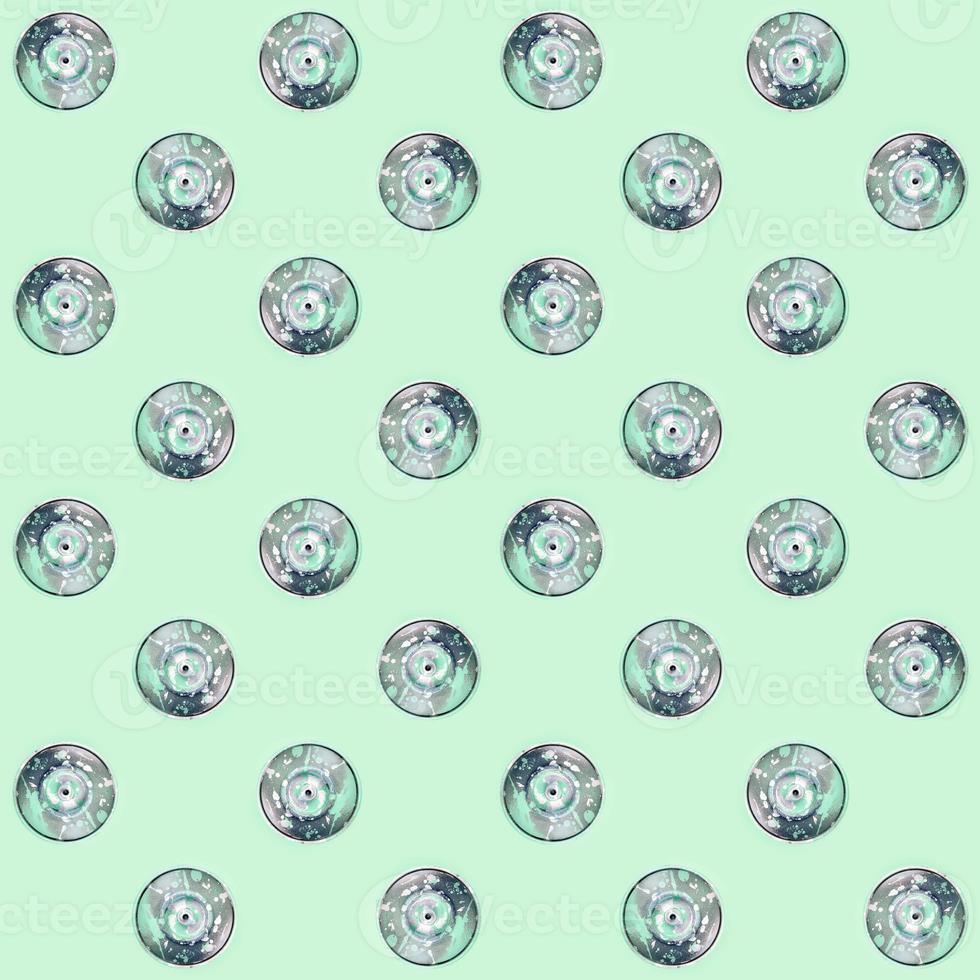 Many used spray cans for graffiti drawing lies on a pastel colored backgroung. Street art painting concept. Minimal flat lay pattern. Top view photo