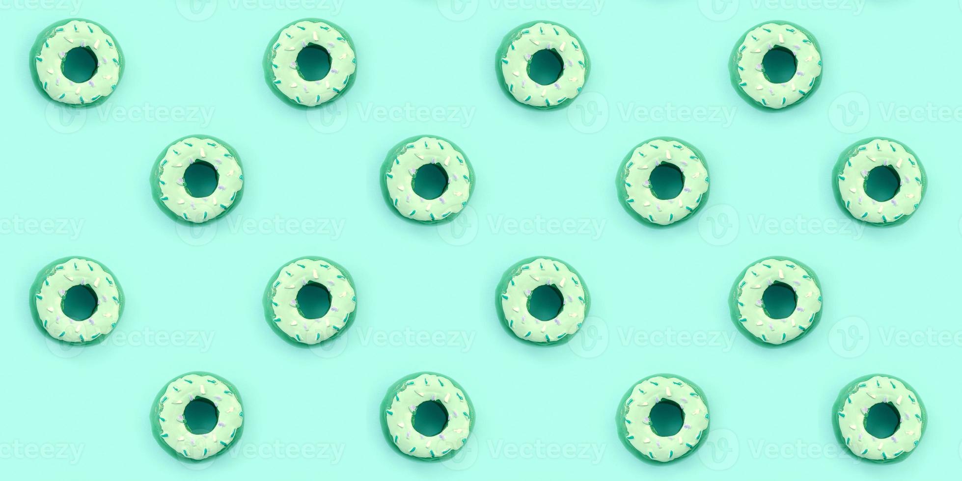 Many small plastic donuts lies on a pastel colorful background. Flat lay minimal pattern. Top view photo