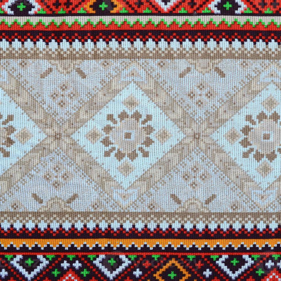 Traditional Ukrainian folk art knitted embroidery pattern on textile fabric photo