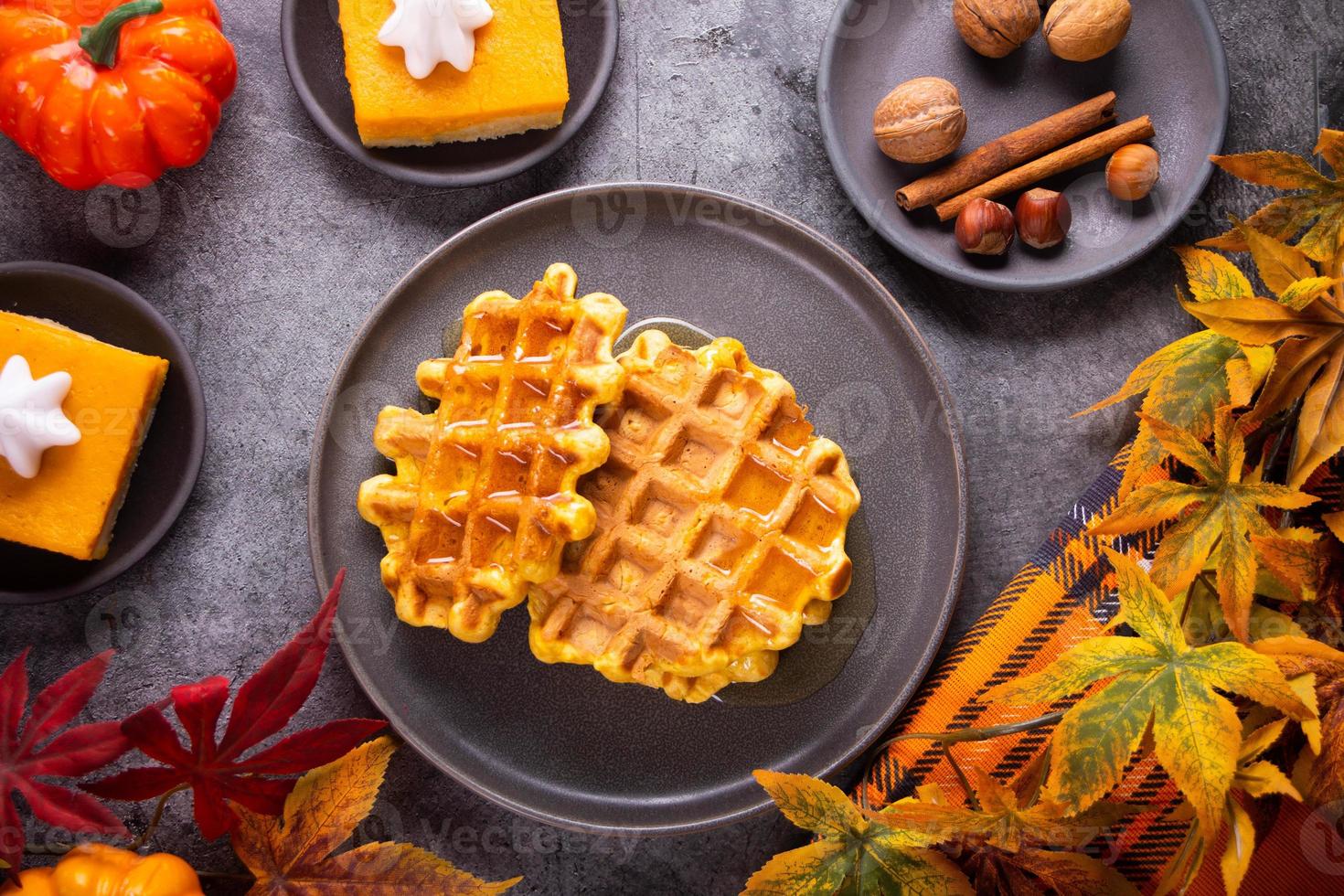Autumn homemade pumpkin spice waffles with honey topping. photo
