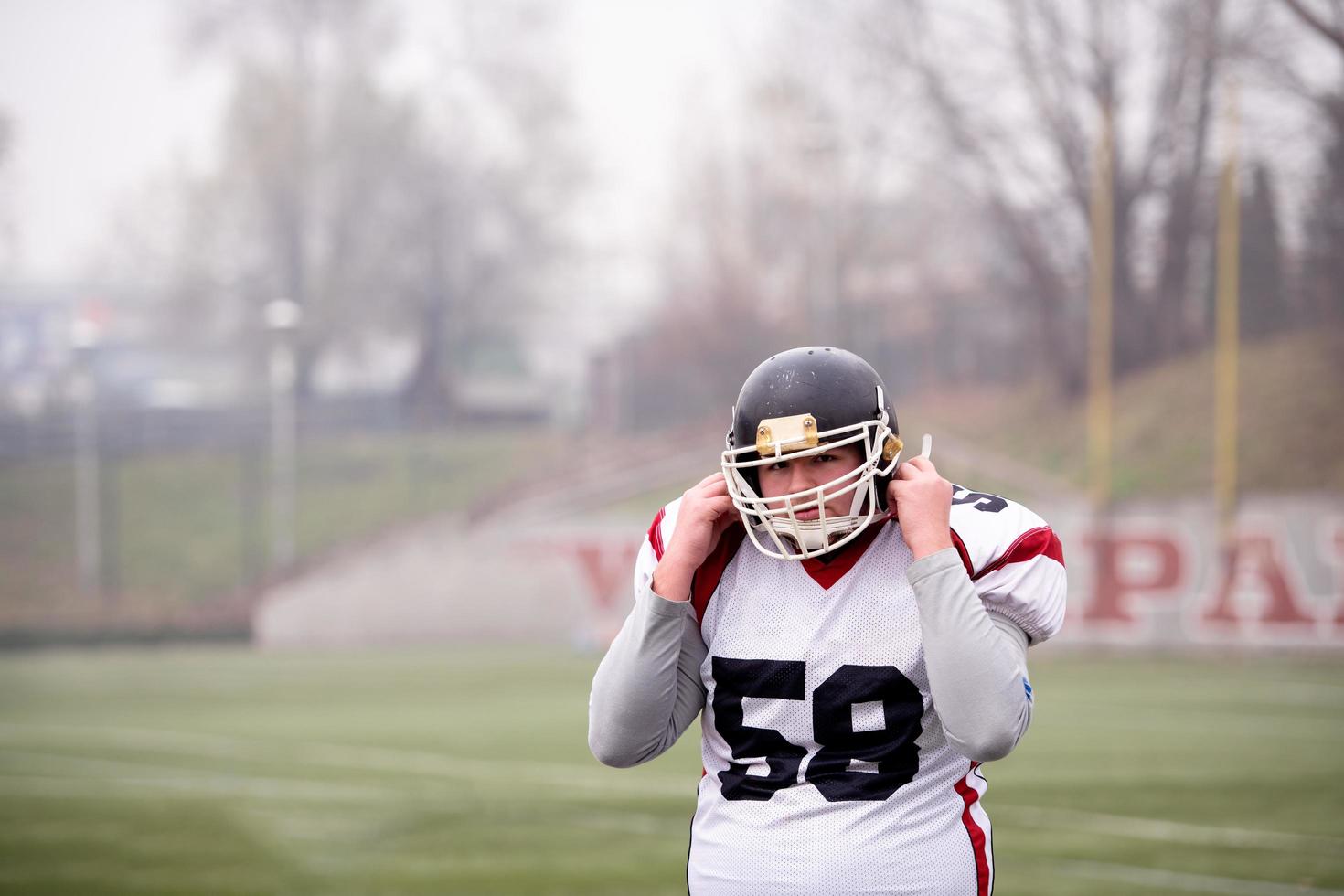 portrait of young confident American football player photo