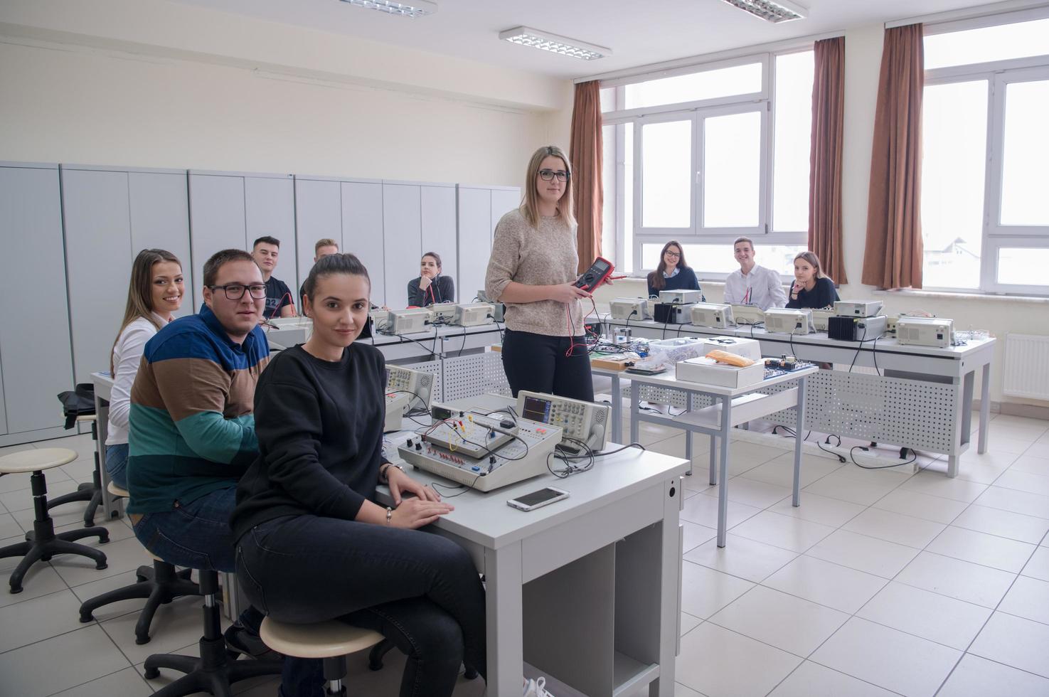 students doing practice in the electronic classroom photo