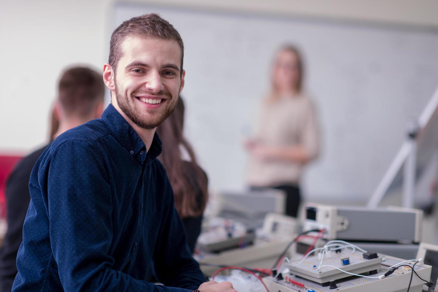 students doing practice in the electronic classroom photo