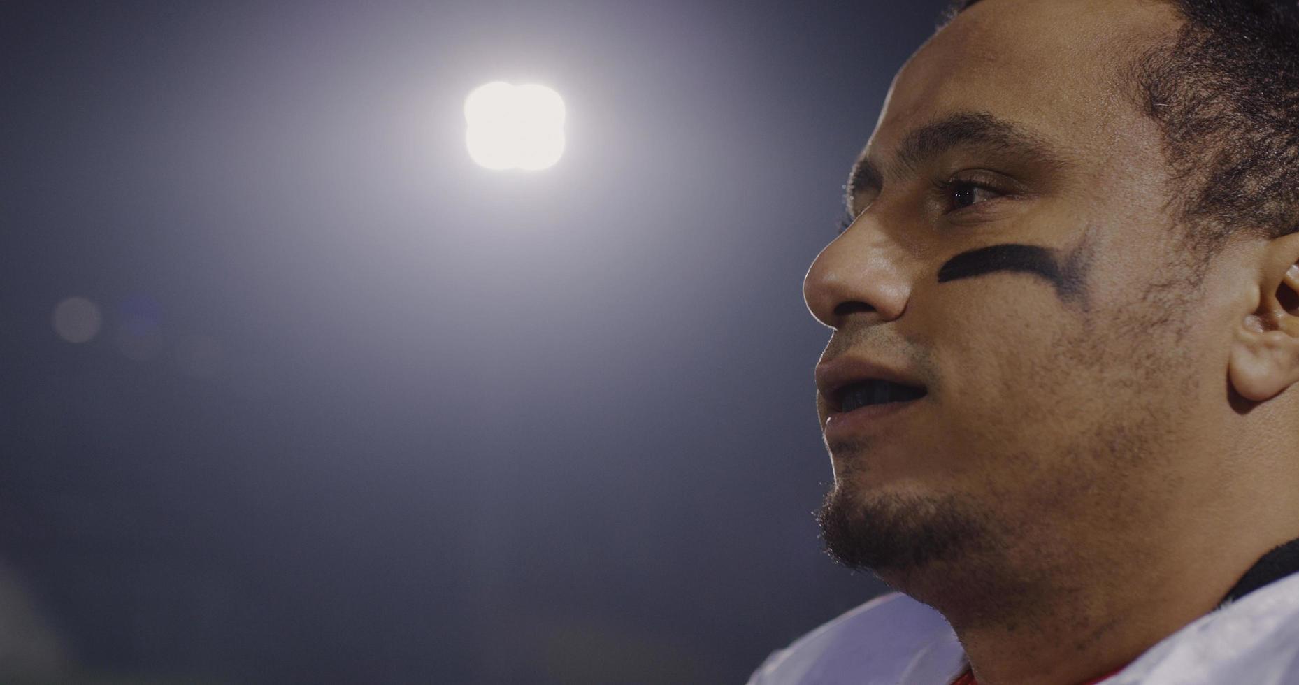 portrait of young confident American football player photo