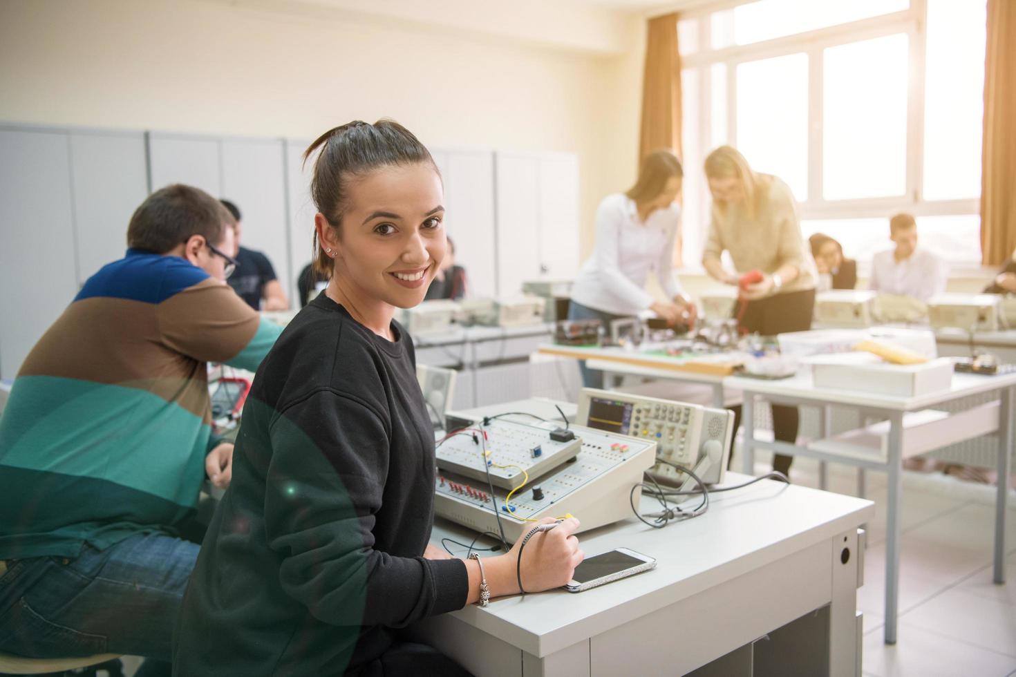 students doing practice in the electronic classroom photo