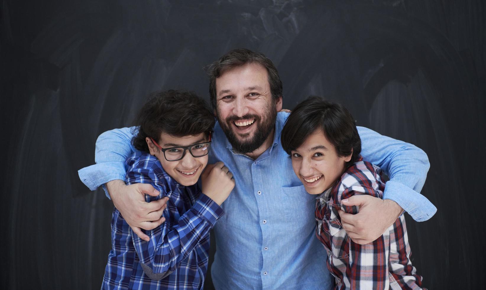 happy father hugging sons photo