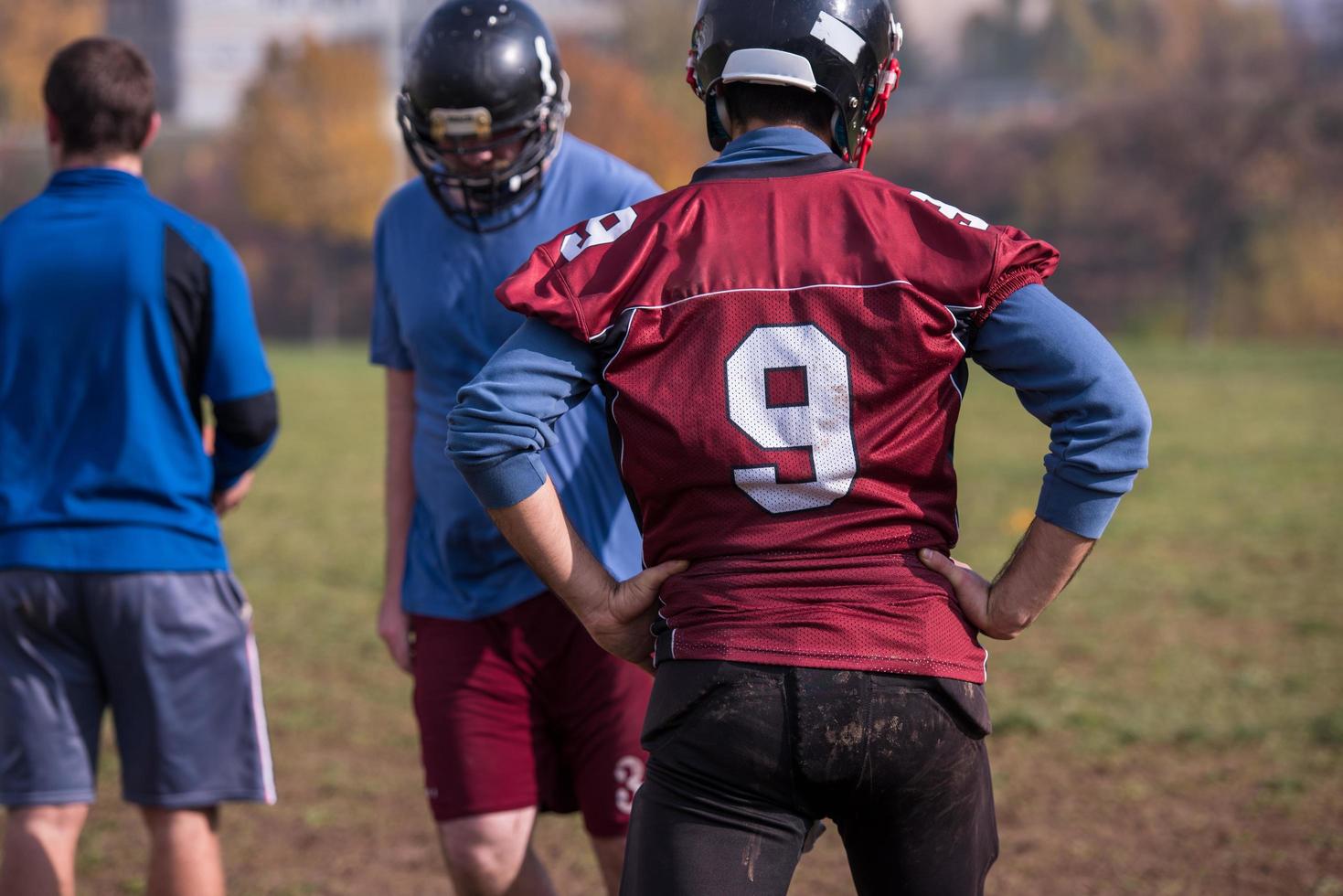 american football team in action photo