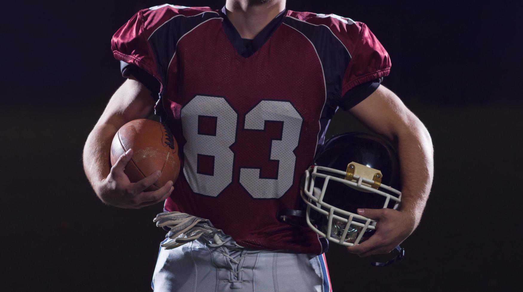 portrait of young confident American football player photo