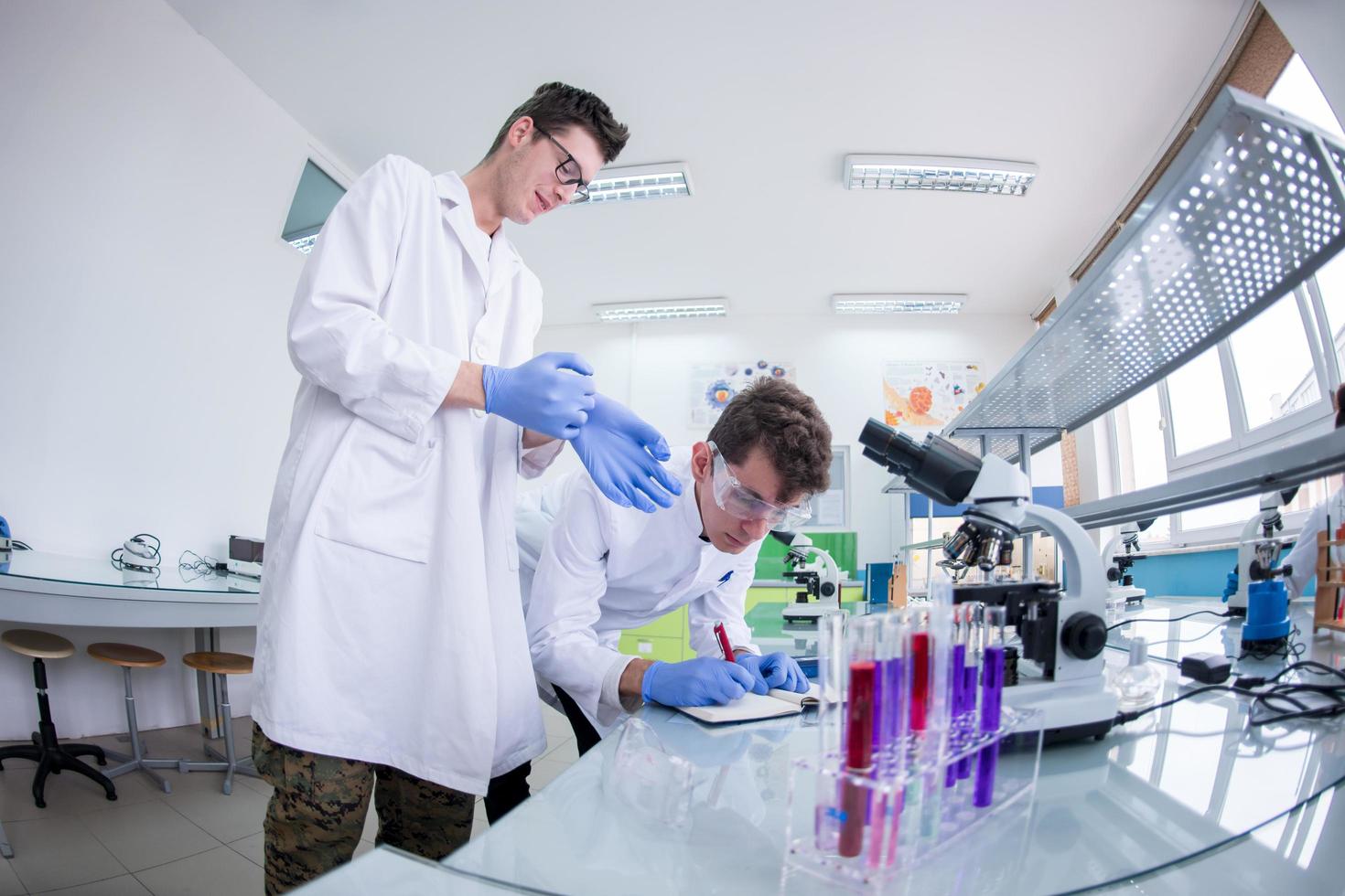 Group of young medical students doing research photo