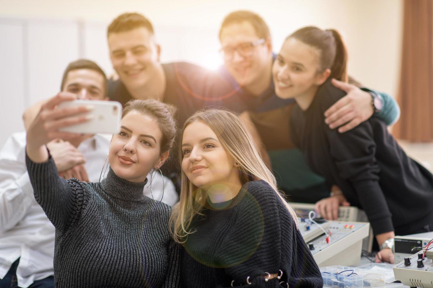 young happy students doing selfie picture photo