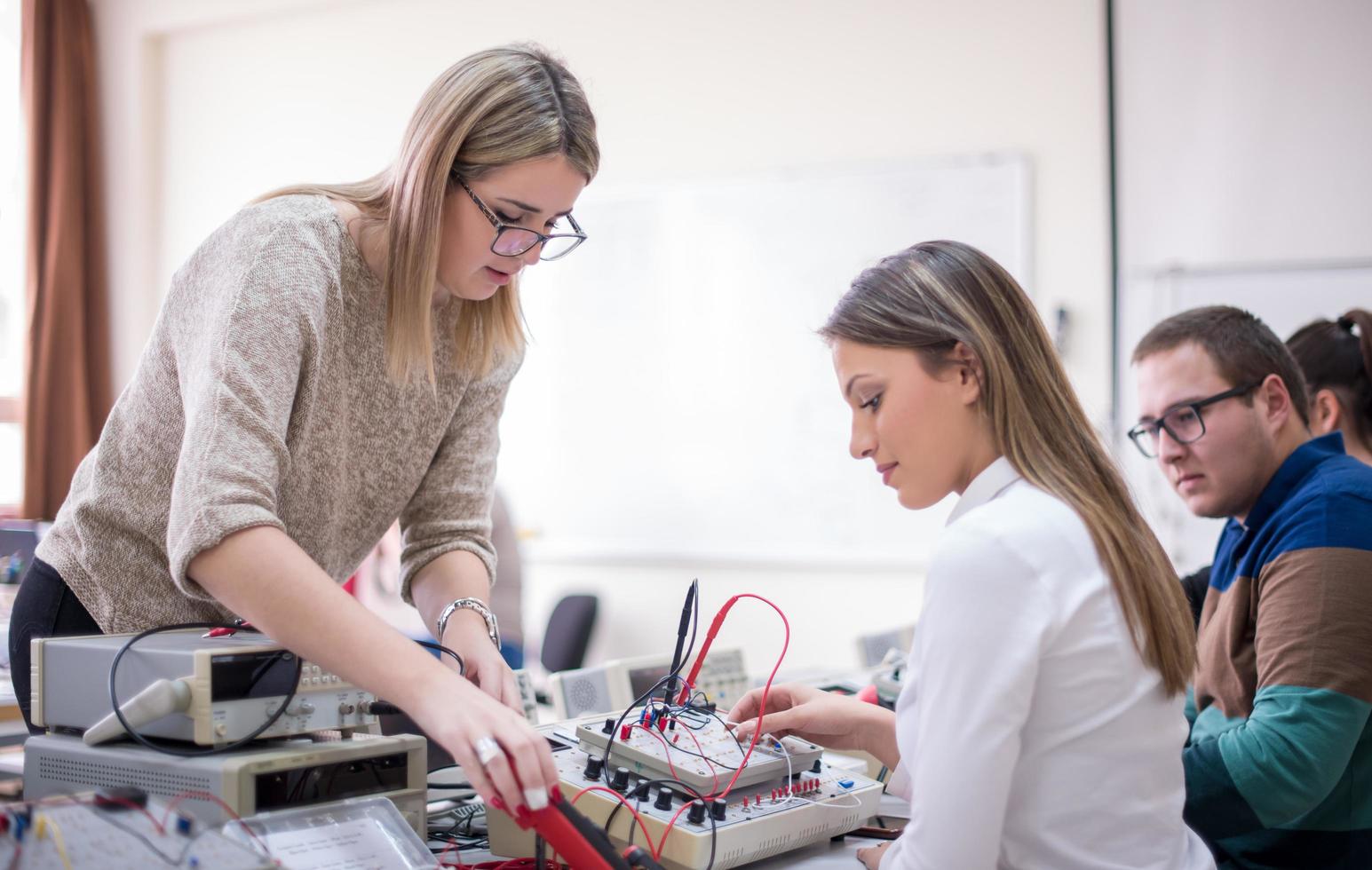 students doing practice in the electronic classroom photo