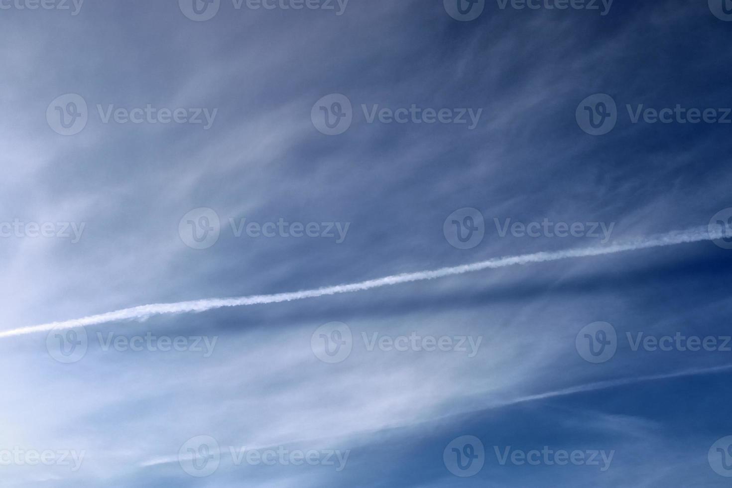 Stunning cirrus cloud formation panorama in a deep blue sky photo