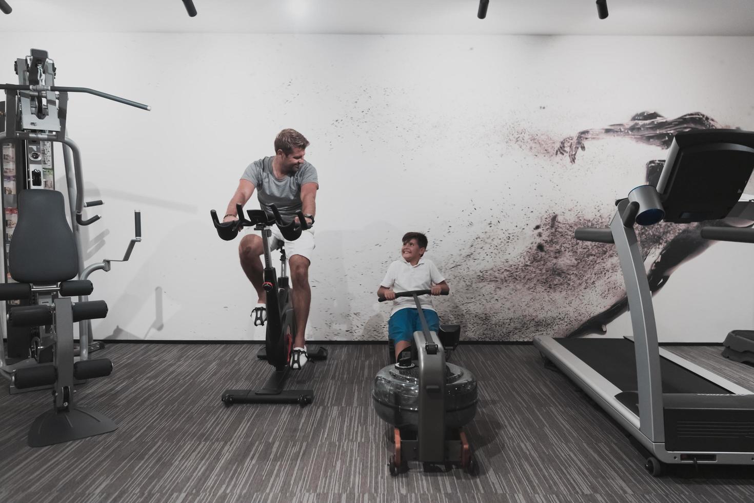 Father and son train together at home gym. The concept of healthy life. Selective focus photo