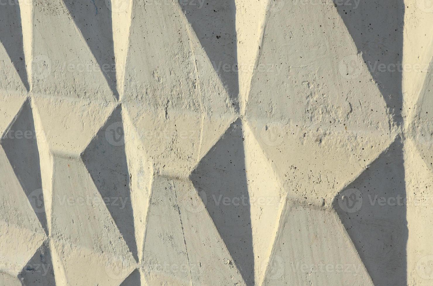 Texture of a relief concrete wall of beige color photo