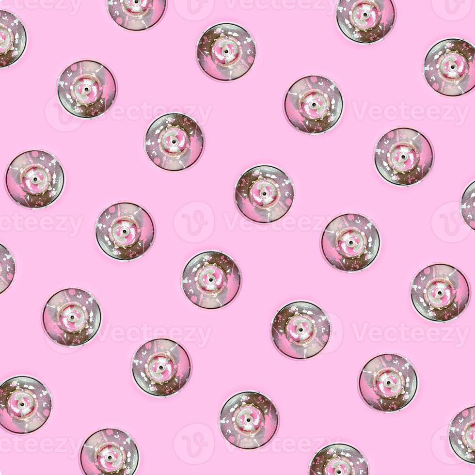 Many used spray cans for graffiti drawing lies on a pastel colored backgroung. Street art painting concept. Minimal flat lay pattern. Top view photo