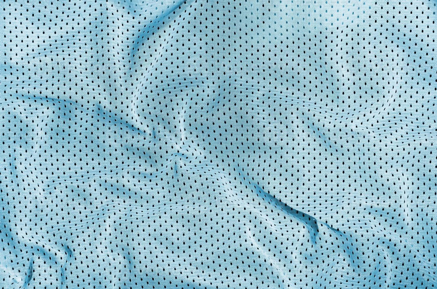 Sport clothing fabric texture background, top view of light blue cloth textile surface photo